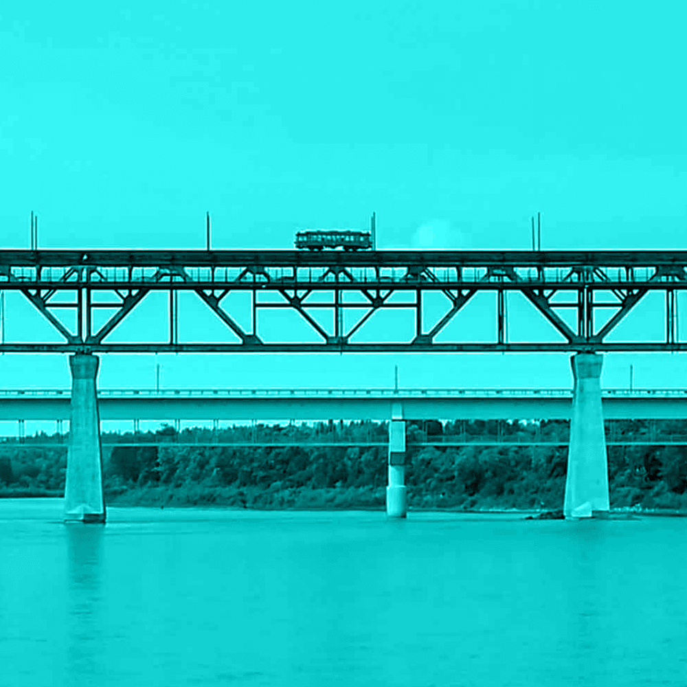 Green-filtered photo of Edmonton High Level Bridge (truss bridge) with trolley on it