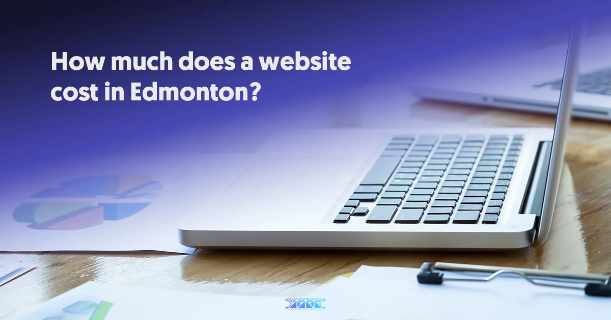 Sideview of laptop on desk with chart documents