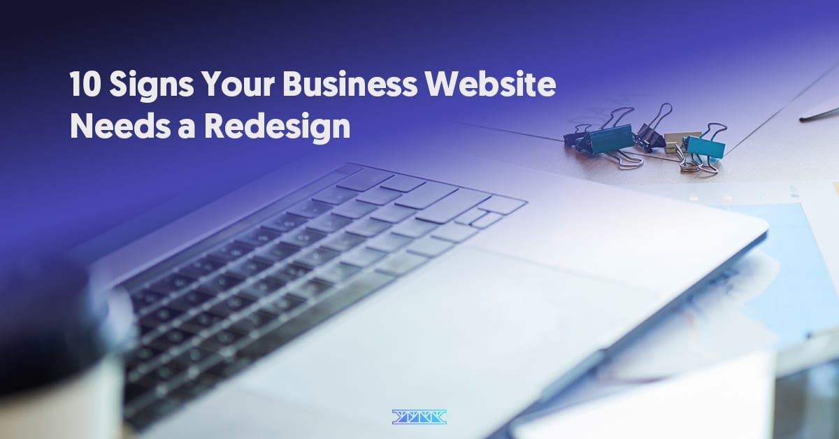 Laptop with coffee and clips on office desk